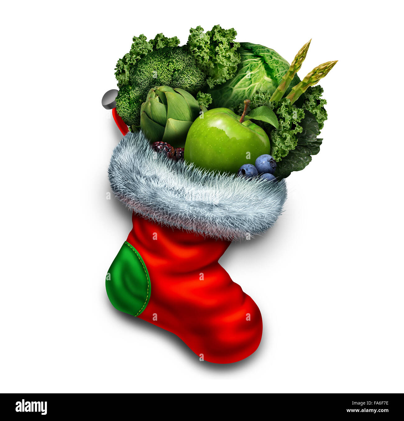 Vacances de manger sain et nouvel an dieting résolution dans un groupe de légumes verts et de fruits frais dans un bas de Noël rouge comme un symbole de fête d'un cadeau ou végétarien remise en forme d'hiver icône. Banque D'Images