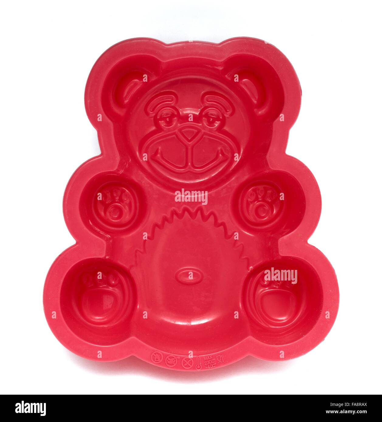 Un ours en silicone rouge moule à pâtisserie Banque D'Images