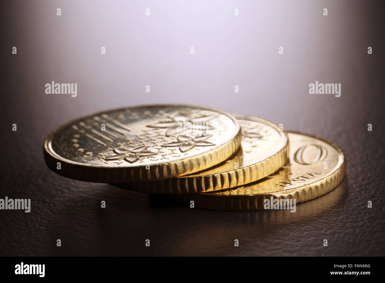 Trois pièces d'or stacks up Banque D'Images