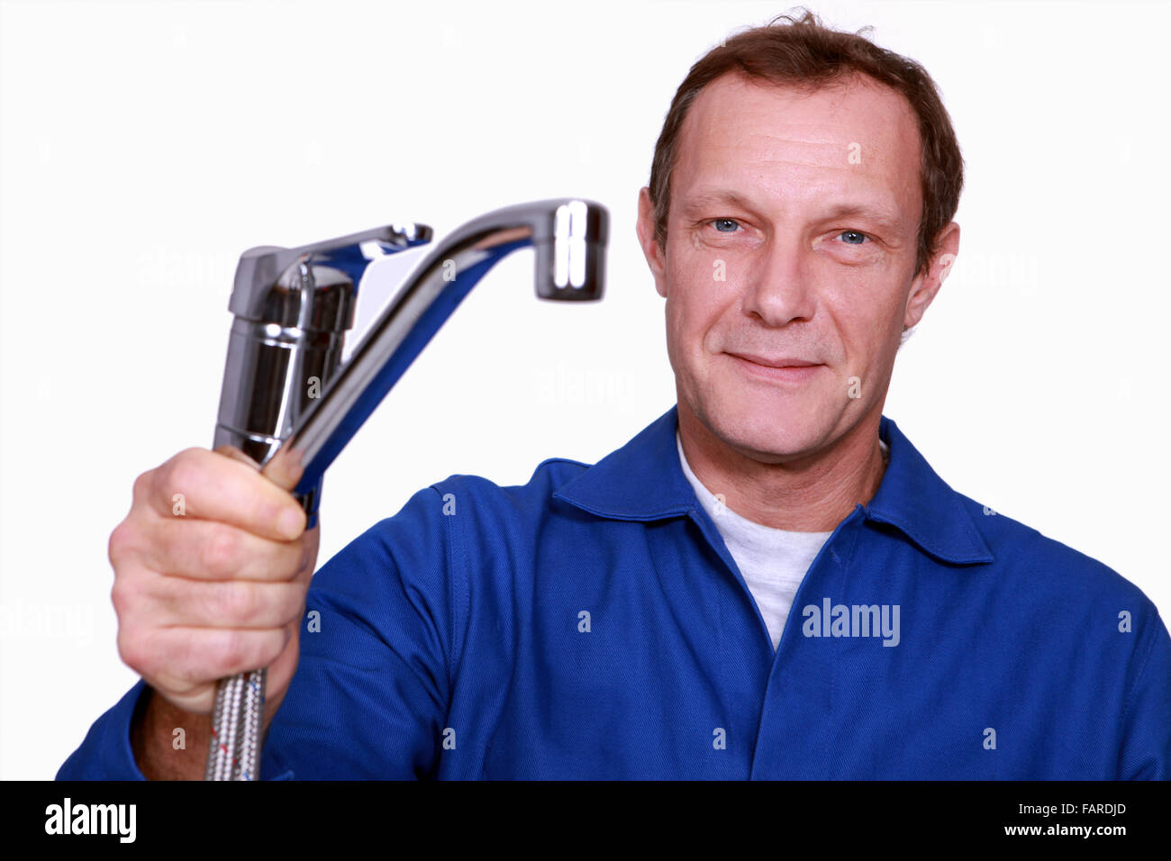 Plombier robinet holding Banque D'Images