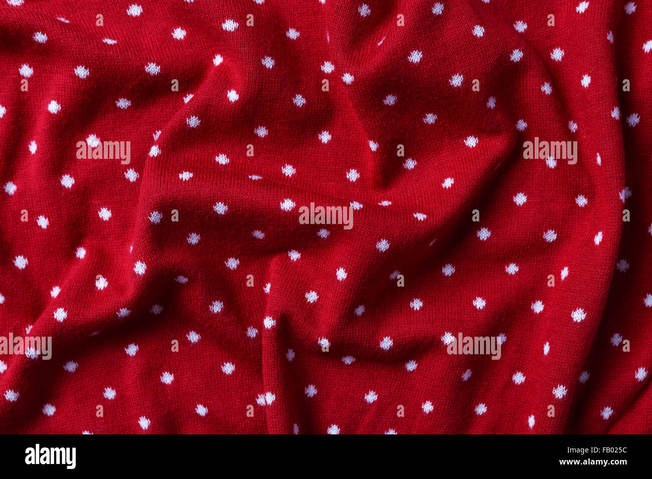 Tissu rouge à pois avec texture background Banque D'Images