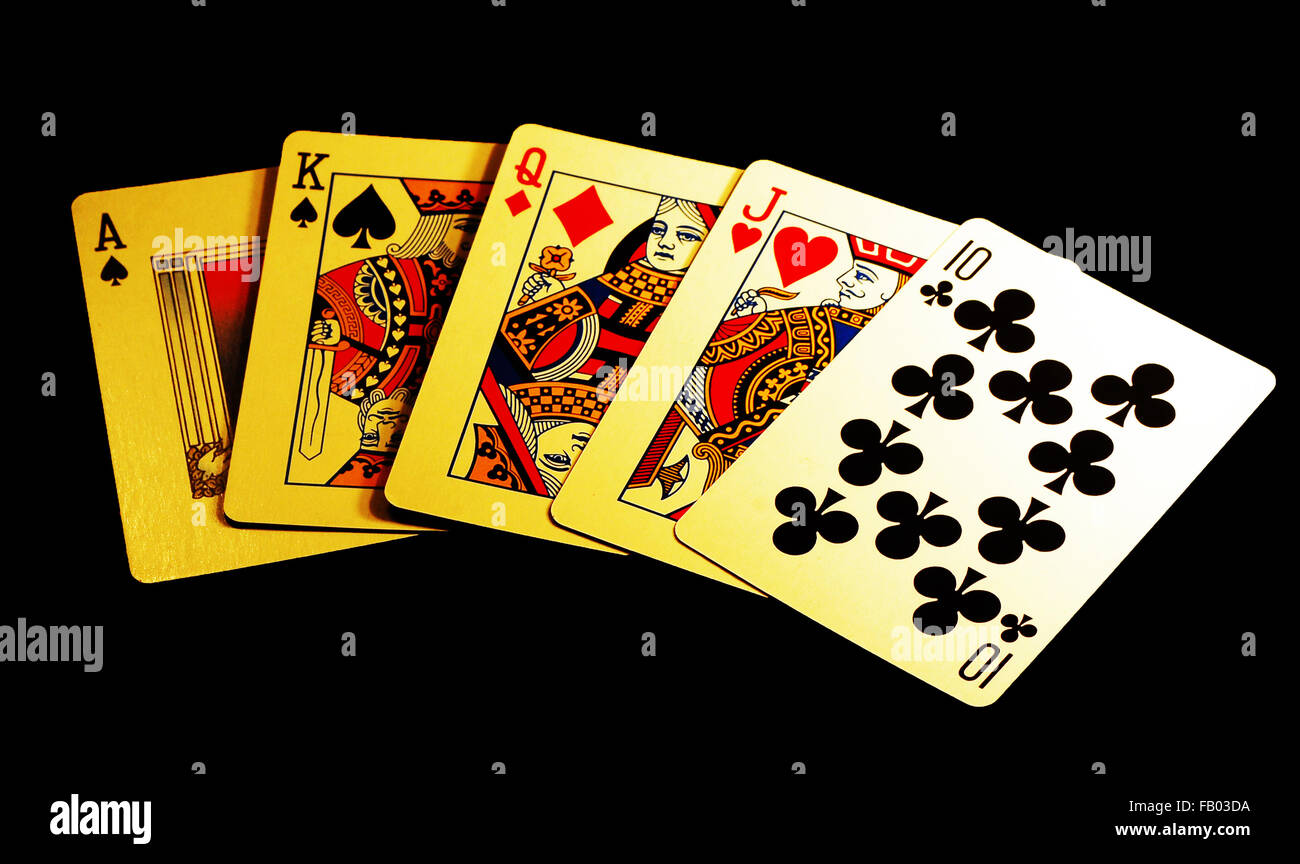 Main de poker,poker,main gagnante,jeu,cartes,ace,king,reine,jack,club,fond noir Banque D'Images