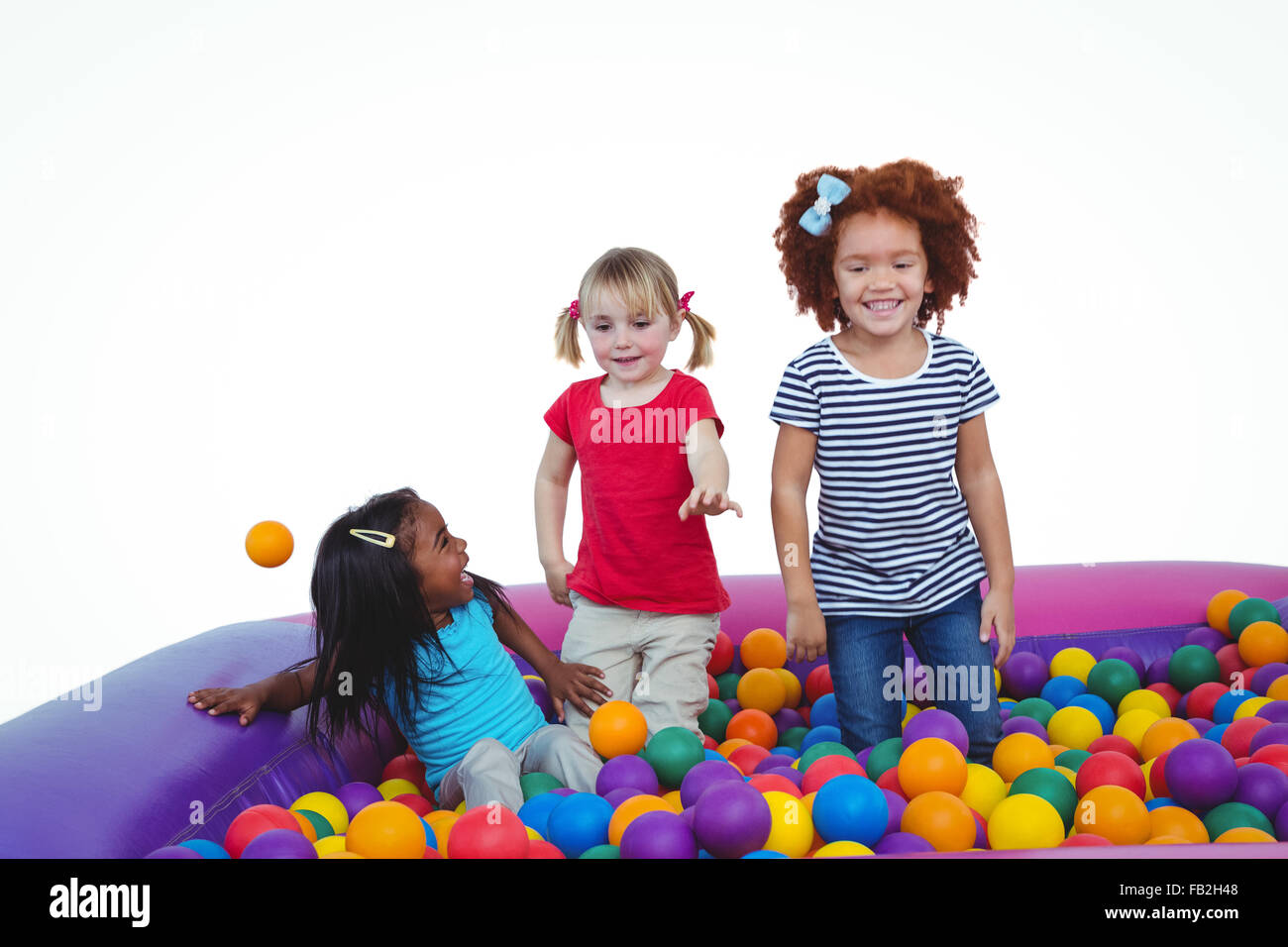 Cute smiling in sponge ball pool Banque D'Images