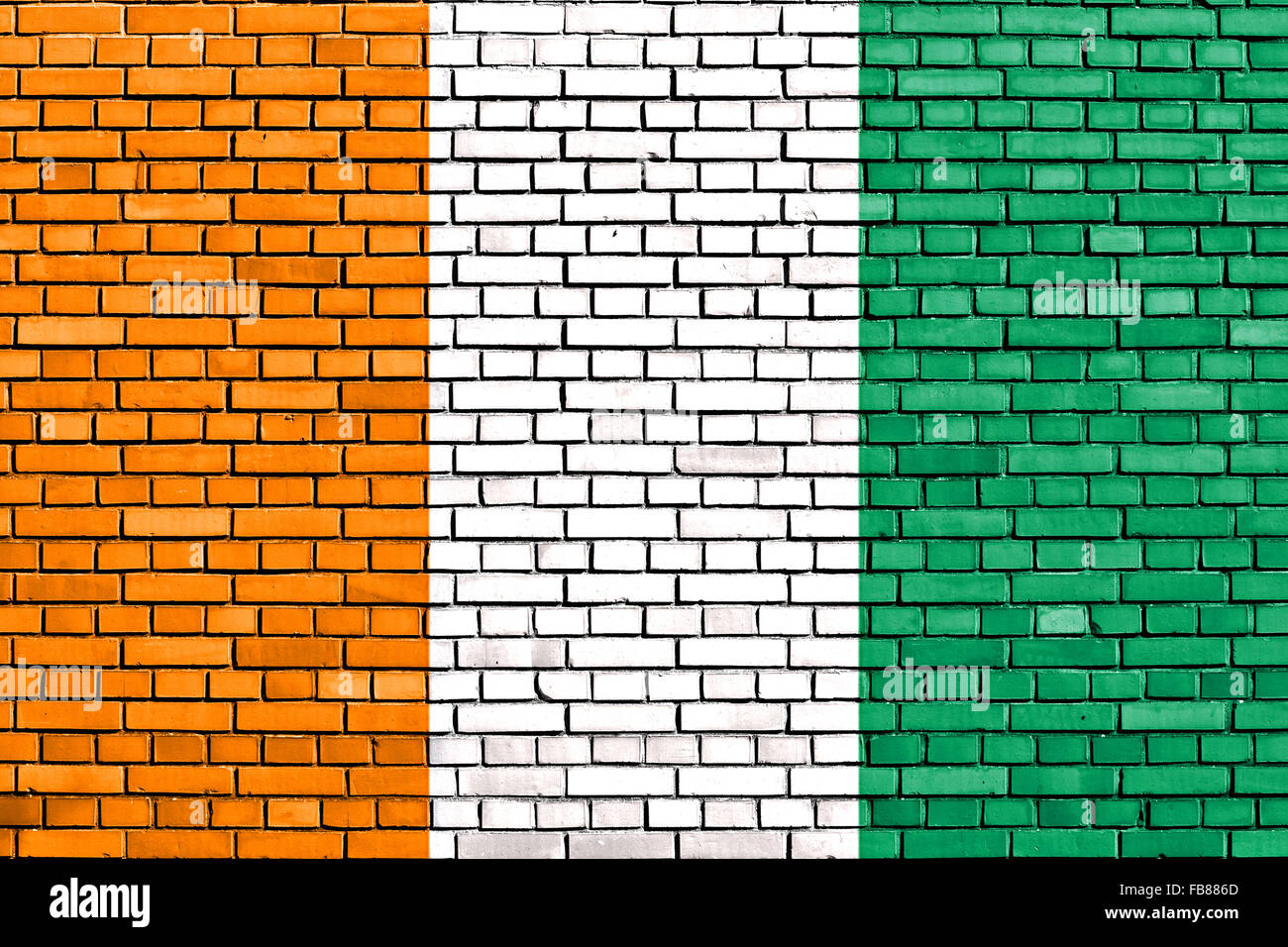 Drapeau de Côte d'Ivoire peint sur mur de brique Banque D'Images