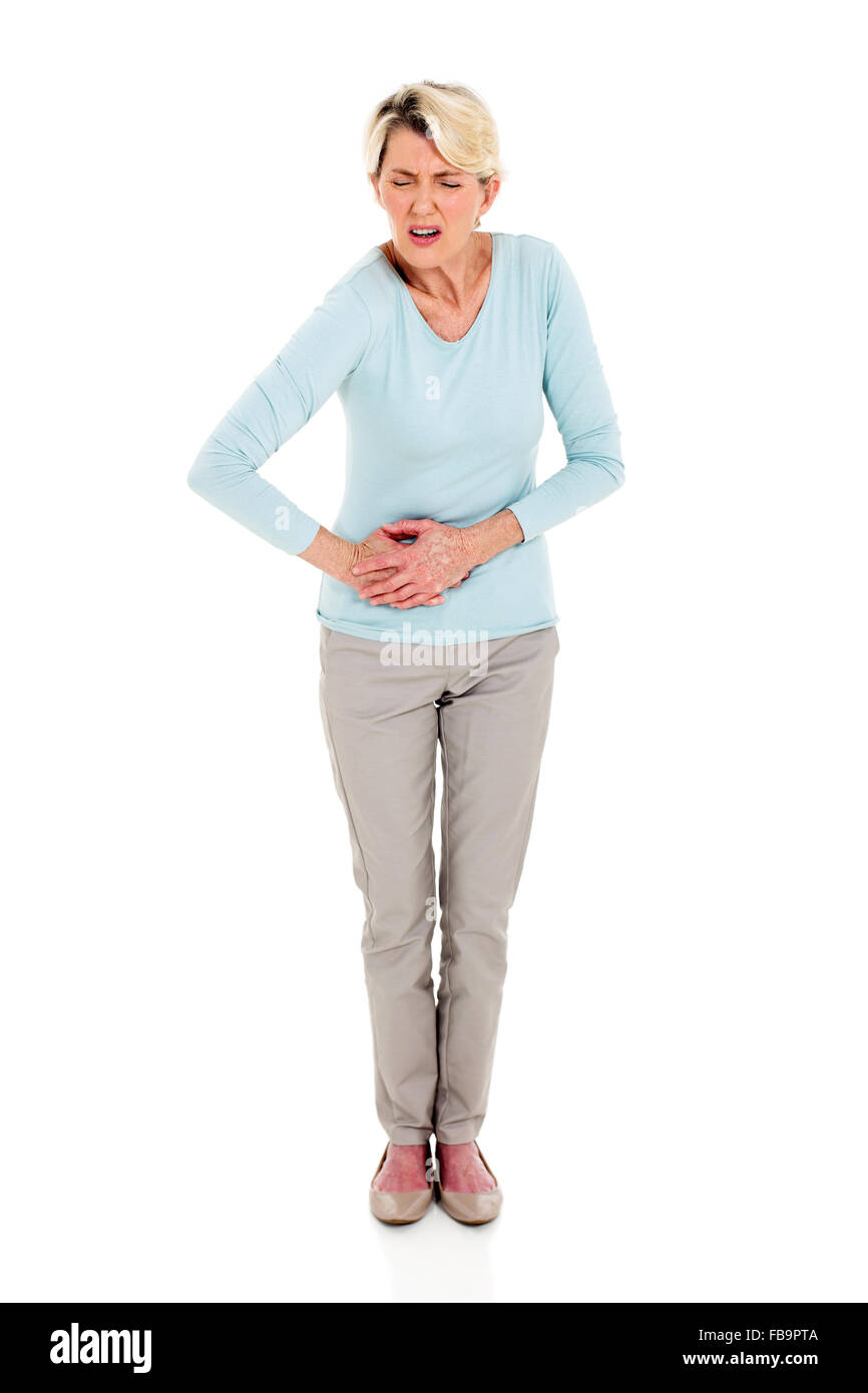 Senior woman having estomac isolated on white Banque D'Images