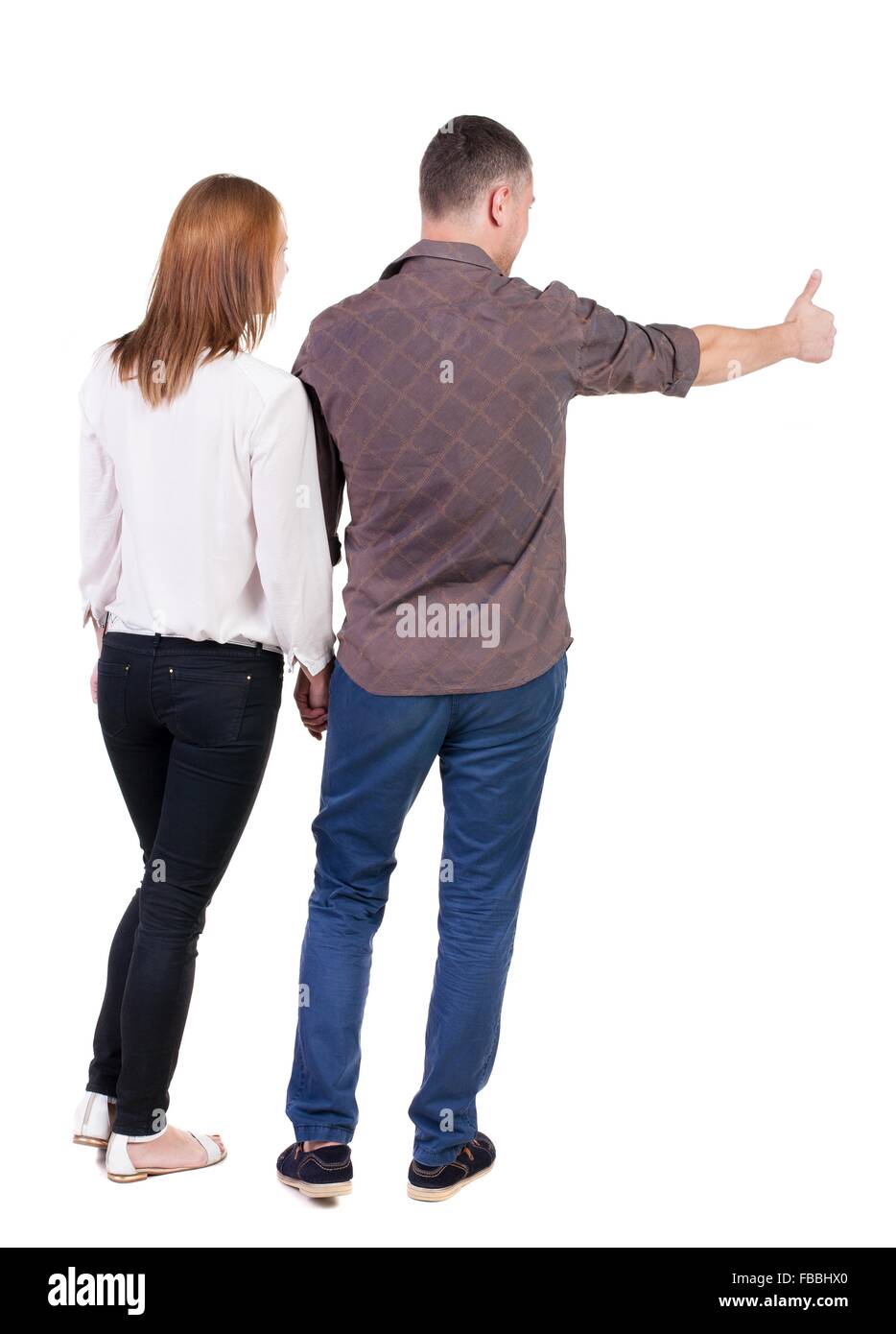Jeune couple pointing at wal vue arrière (femme et homme Jeune couple pointing at wal vue arrière (femme et homme