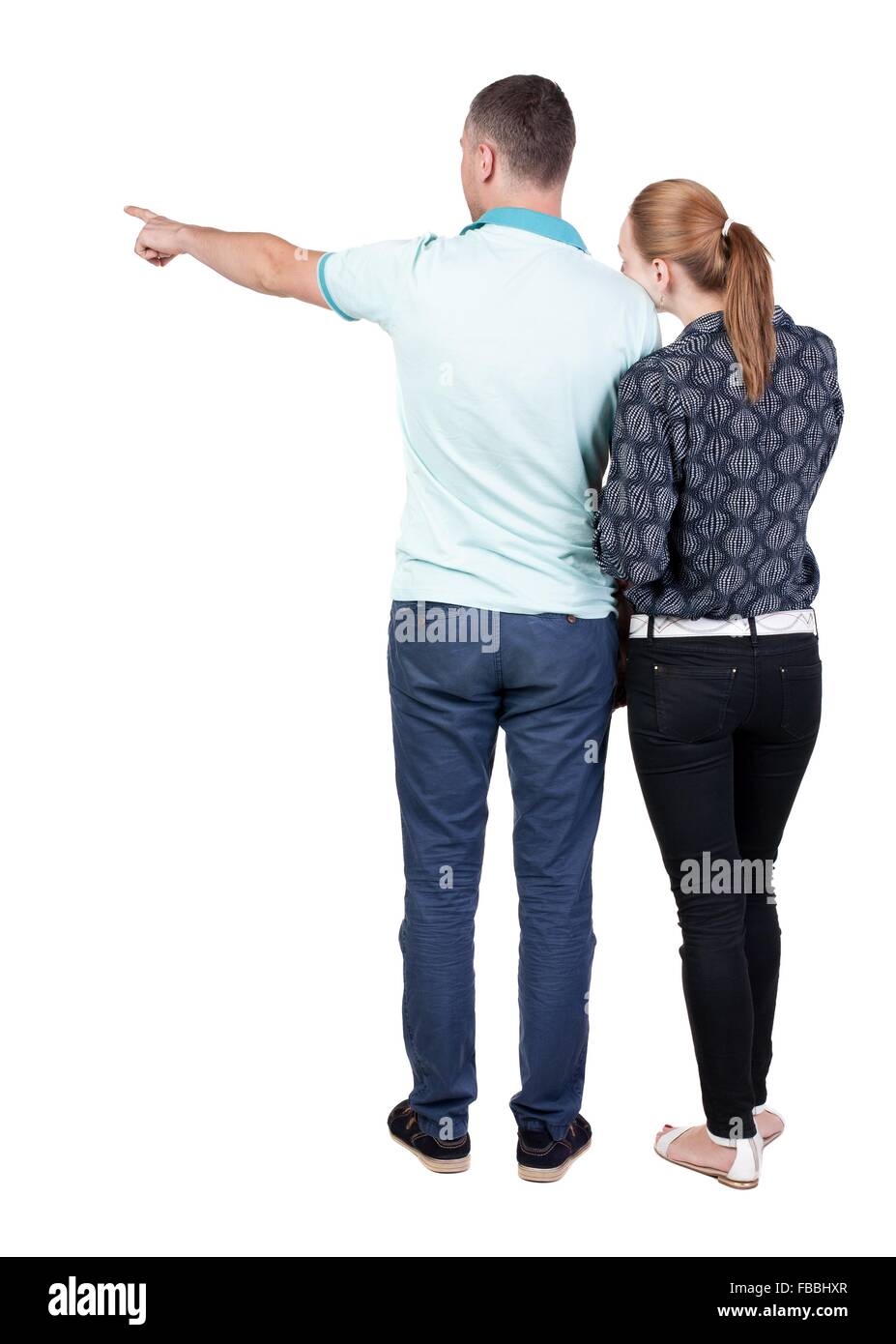 Jeune couple pointing at wal vue arrière (femme et homme Jeune couple pointing at wal vue arrière (femme et homme