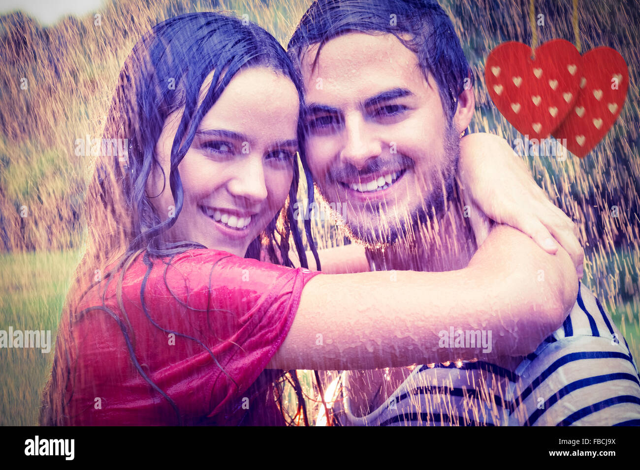 Image composite de cute couple hugging sous la pluie Banque D'Images