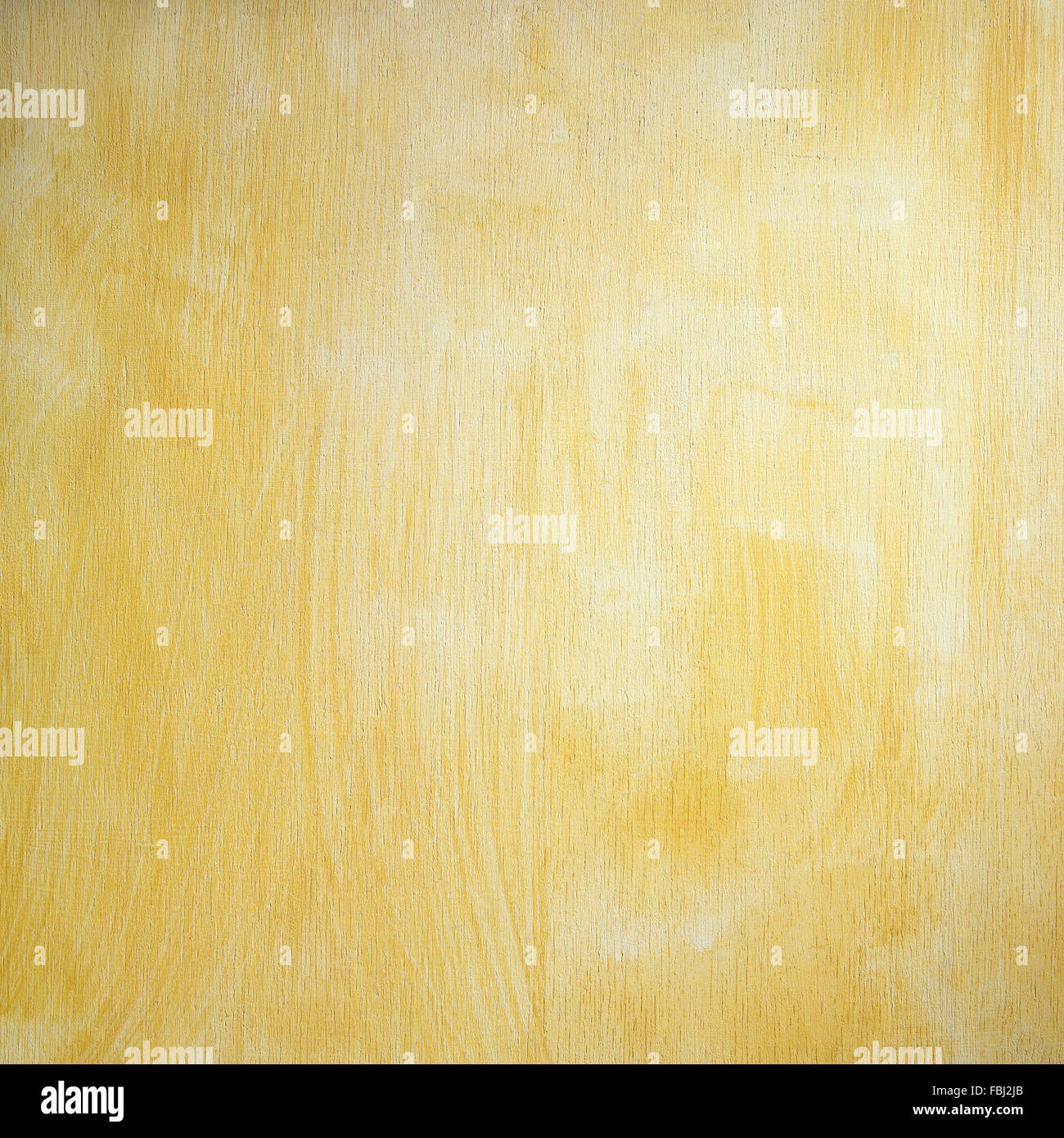 Plaque en bois peint de couleur jaune, les traits de pinceau texture Banque D'Images