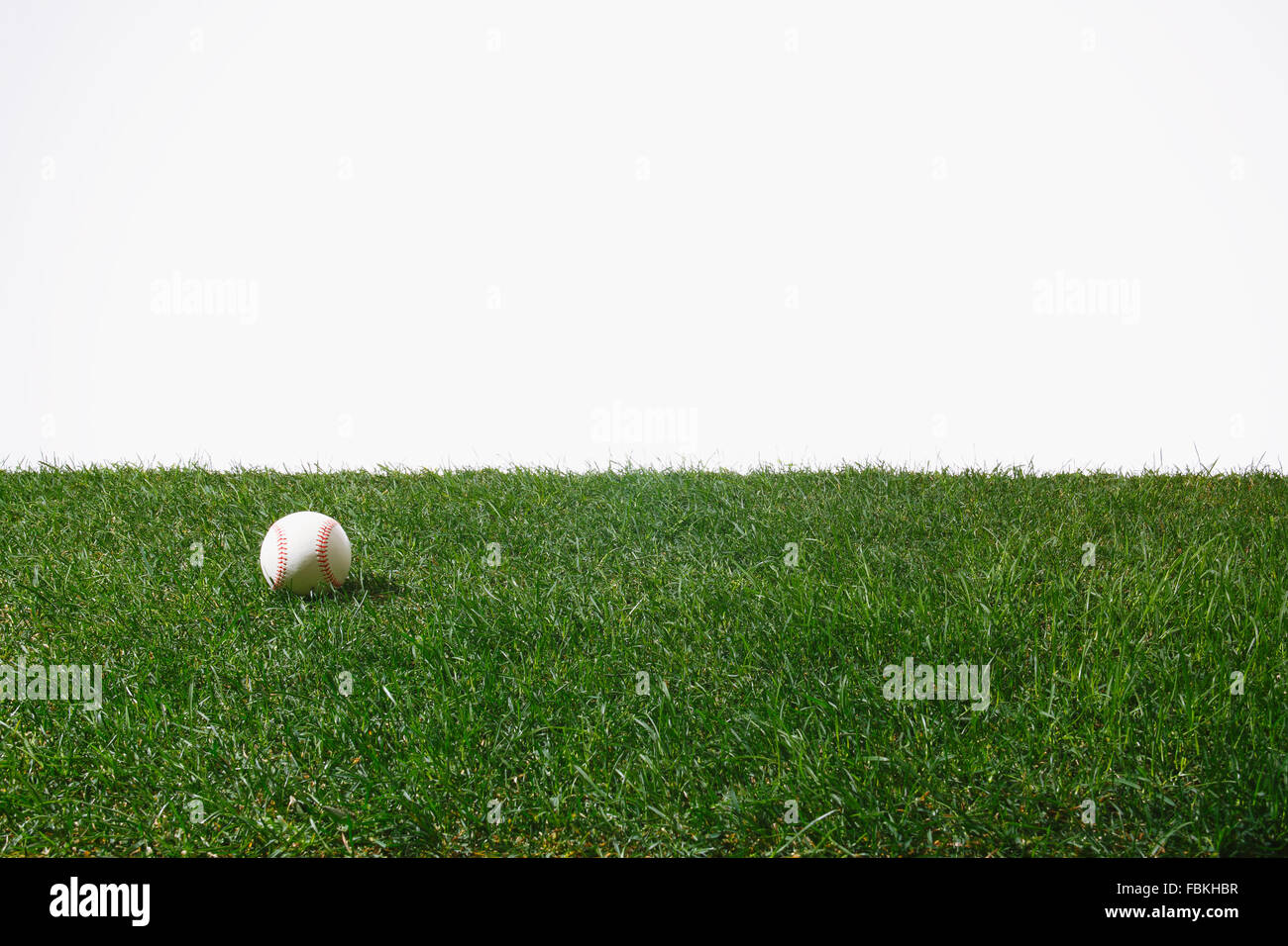 Balle de baseball sur l'herbe Banque D'Images