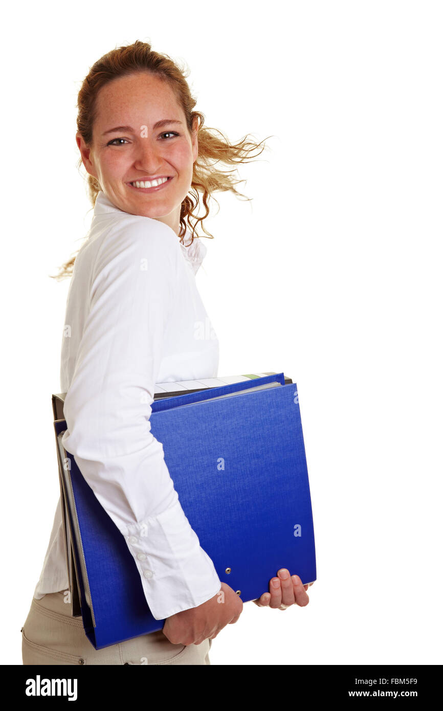 Happy business woman smiling et tournant avec des fichiers Banque D'Images