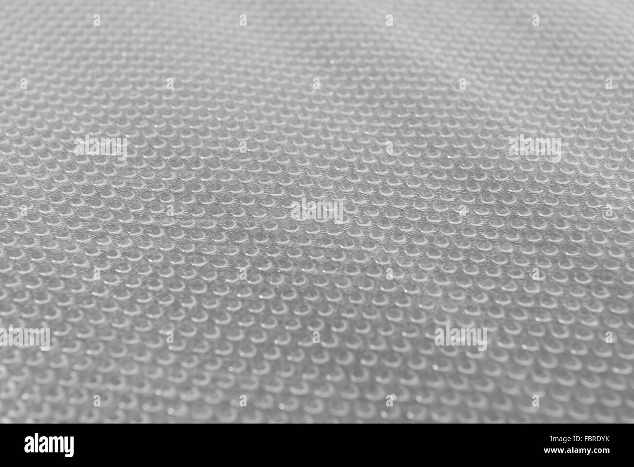 Ce contexte est transparente motif dots de tapis en plastique selective focus Banque D'Images