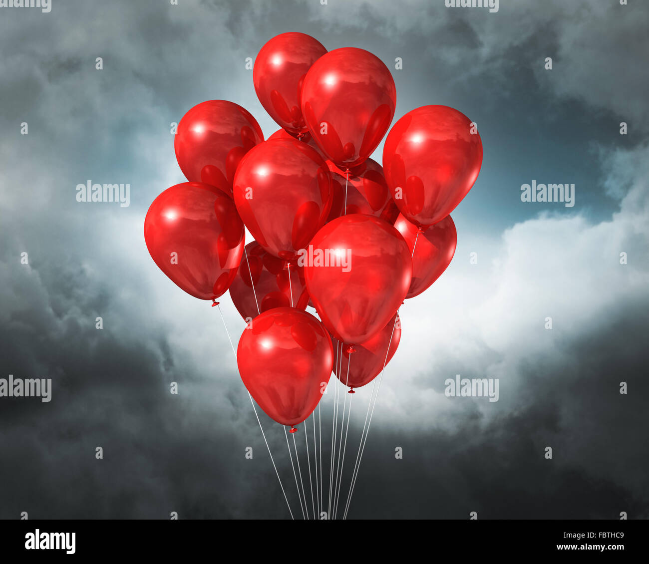 Ballons rouges sur un ciel nuageux ciel dramatique Banque D'Images