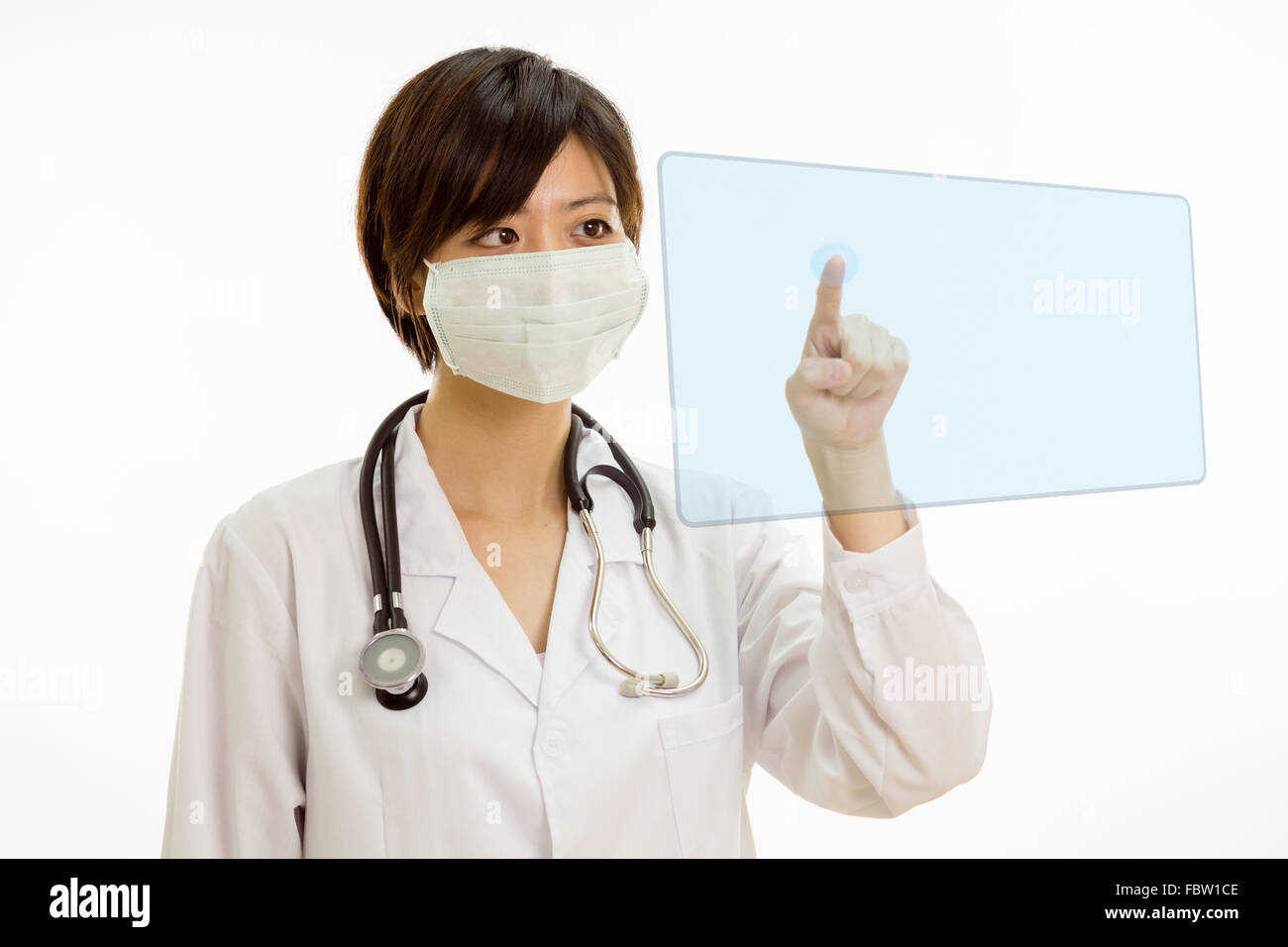 Chinese female doctor with stethoscope en appuyant sur le bouton virtuel sur l'interface avec le doigt Banque D'Images