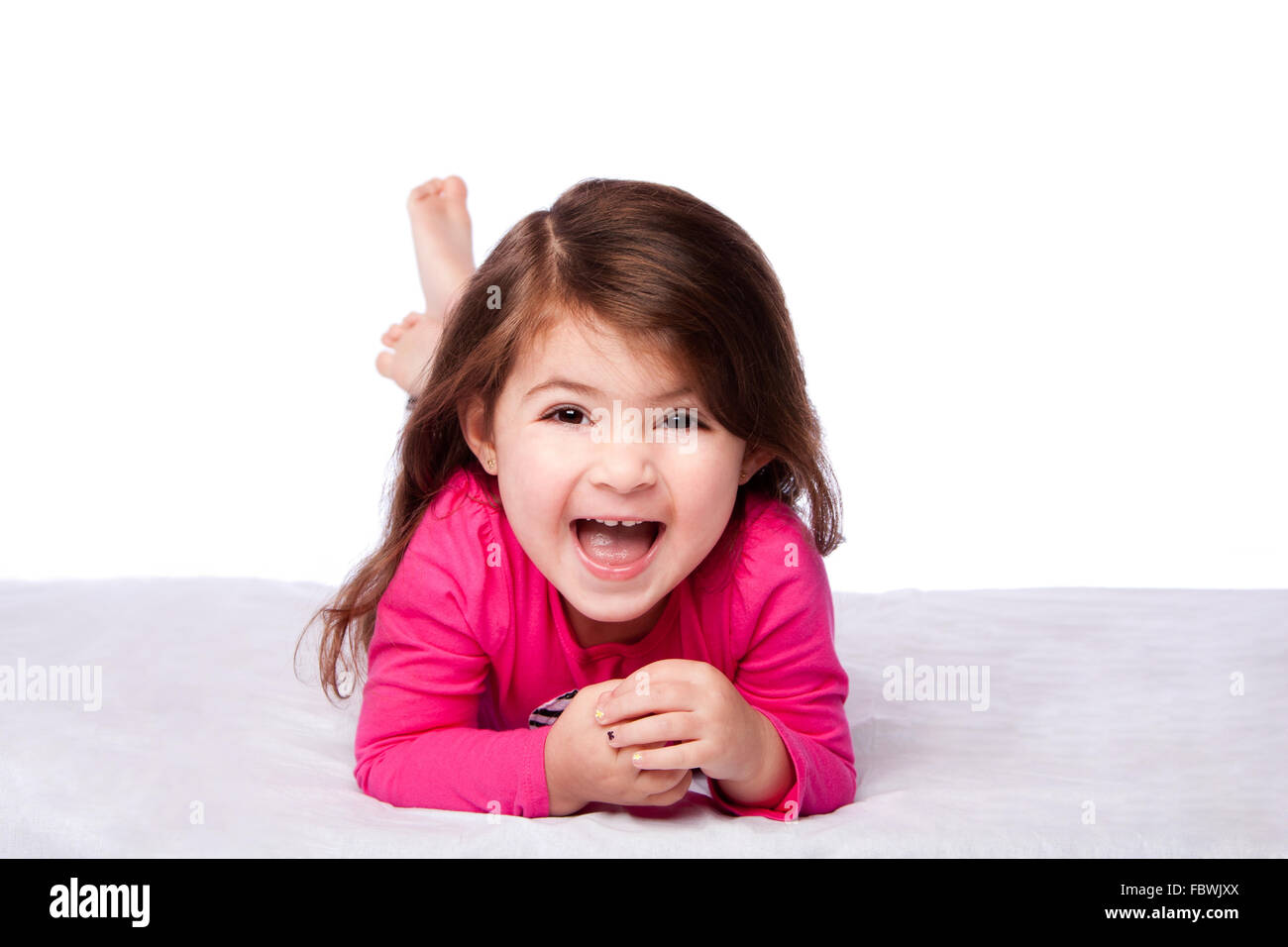 Cute girl laying on belly Banque D'Images