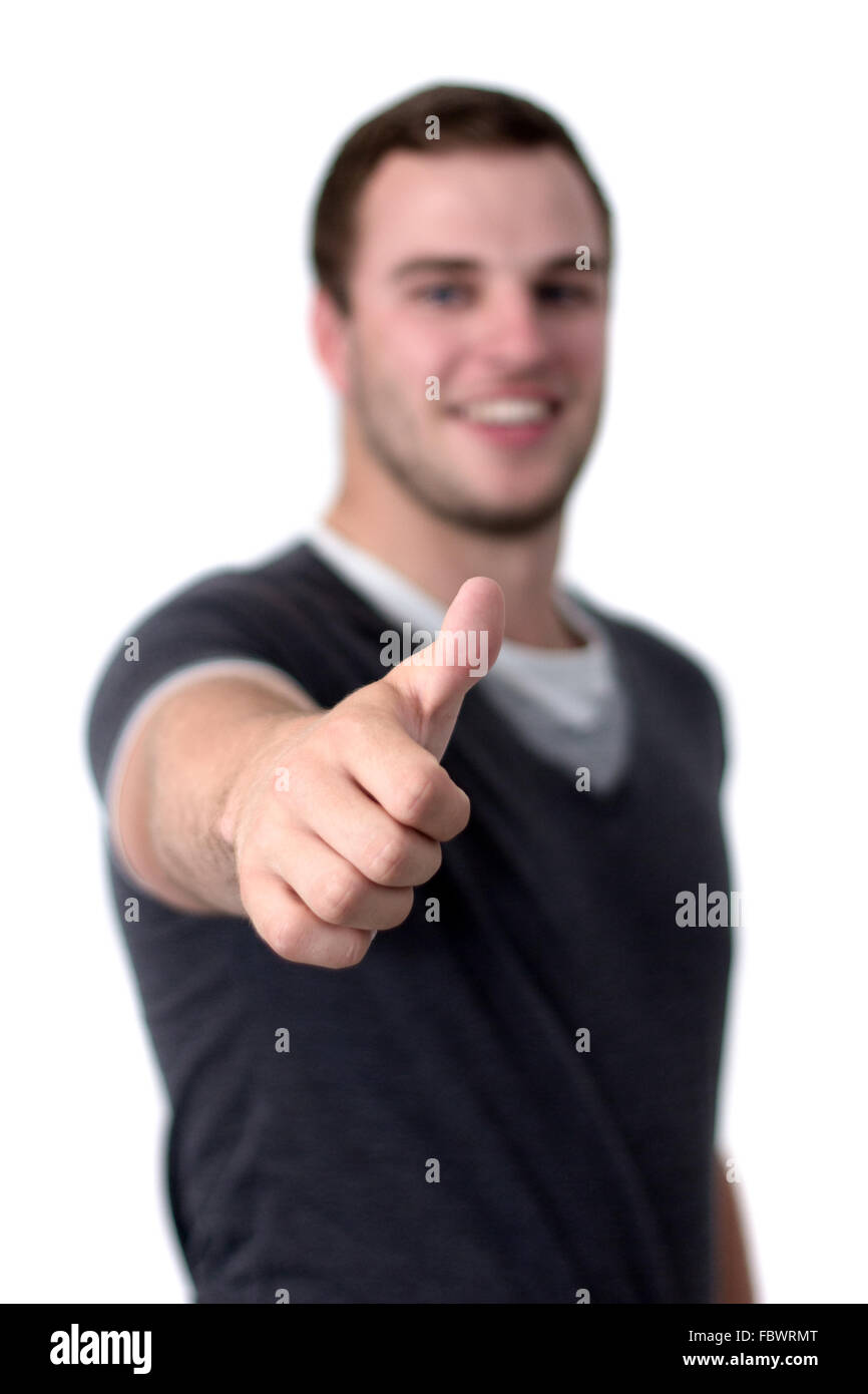 Un jeune homme showing thumb up Banque D'Images