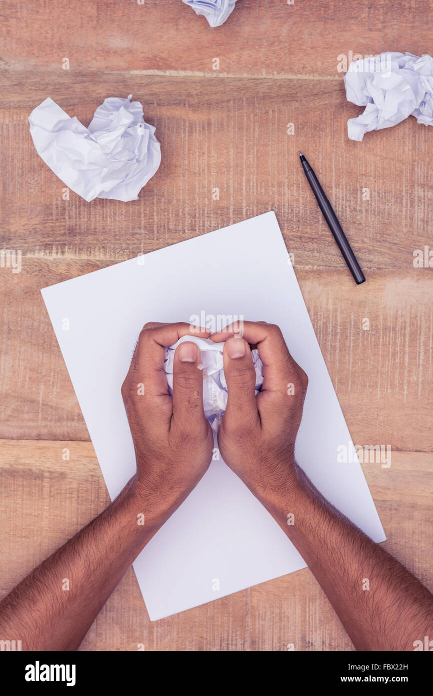 Businessman making paper balls Banque D'Images