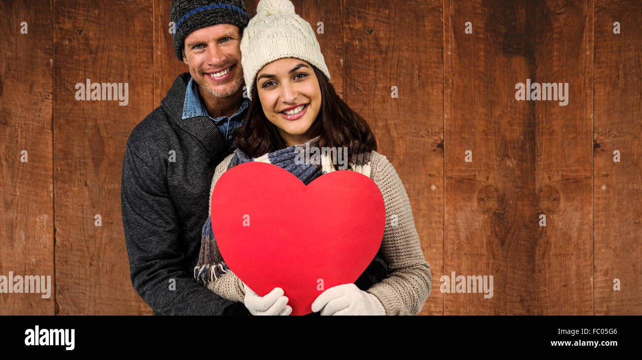 Image composite du couple festif dans les vêtements d'hiver Banque D'Images