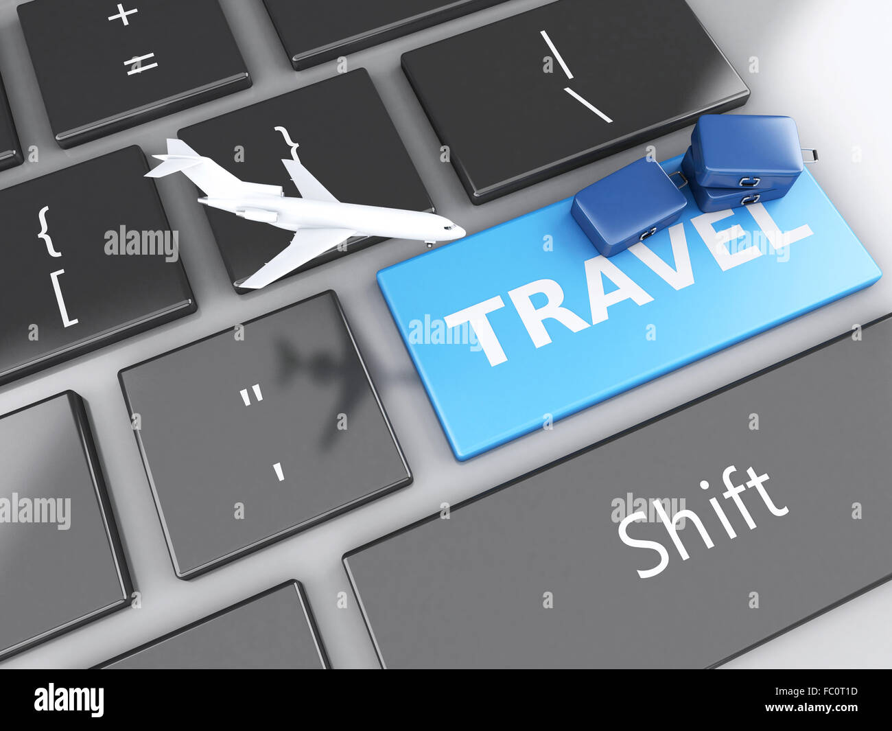 Valise de voyage et d'avion sur le clavier de l'ordinateur. Banque D'Images