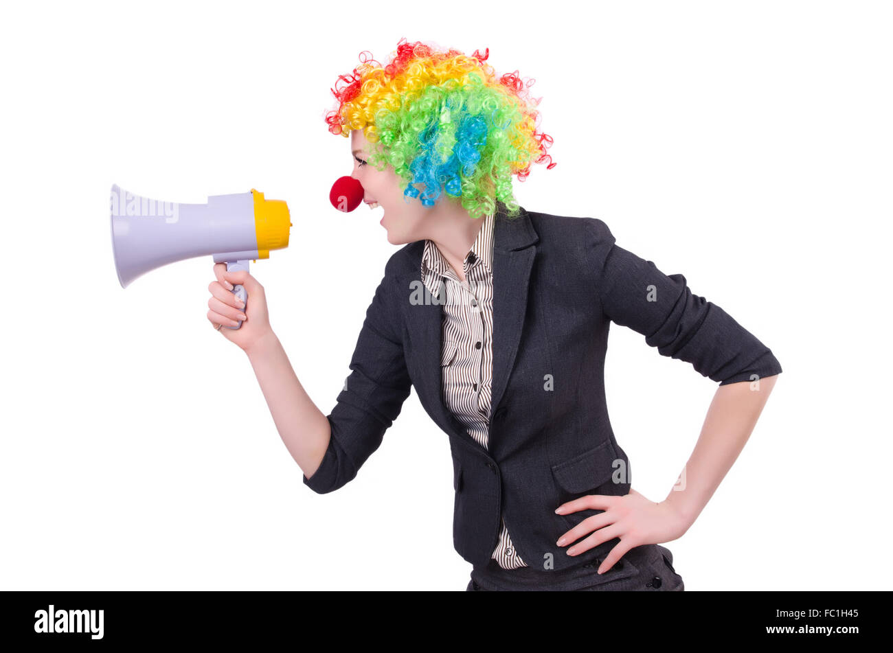Businesswoman clown avec haut-parleur isolated on white Banque D'Images