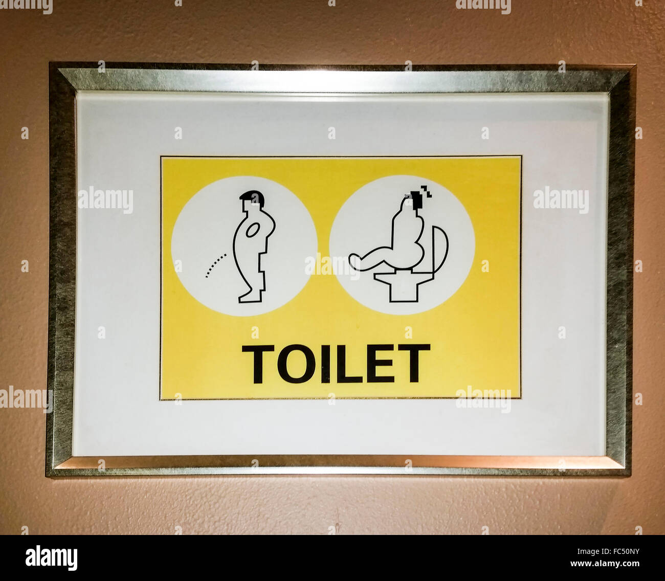 Inscrivez-vous dans une toilette publique de laisser les gens savent quel genre de toilettes se trouvent à l'intérieur. Banque D'Images