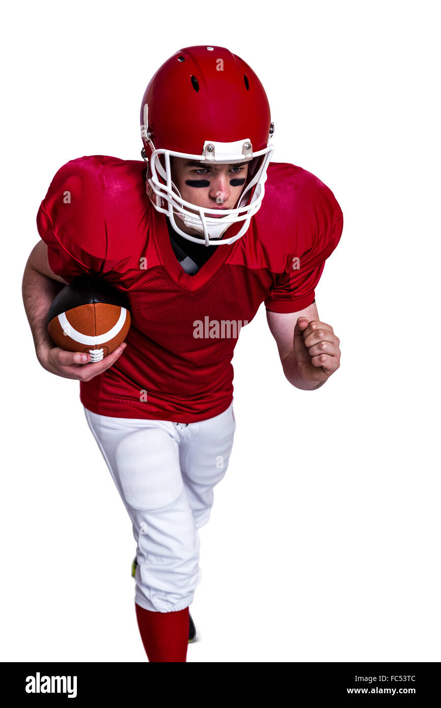 American football player exécutant avec la balle Banque D'Images