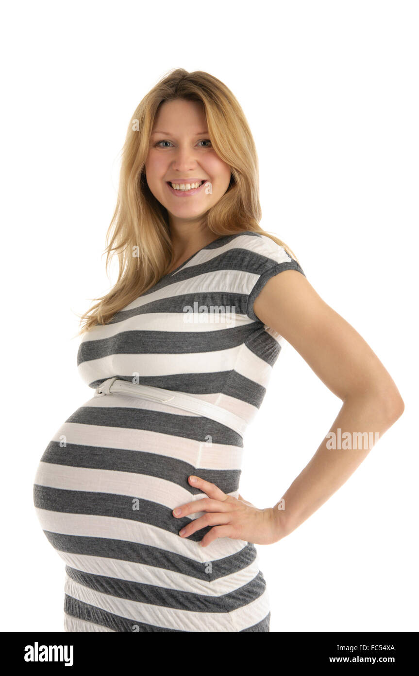 Happy pregnant woman in robe rayée Banque D'Images