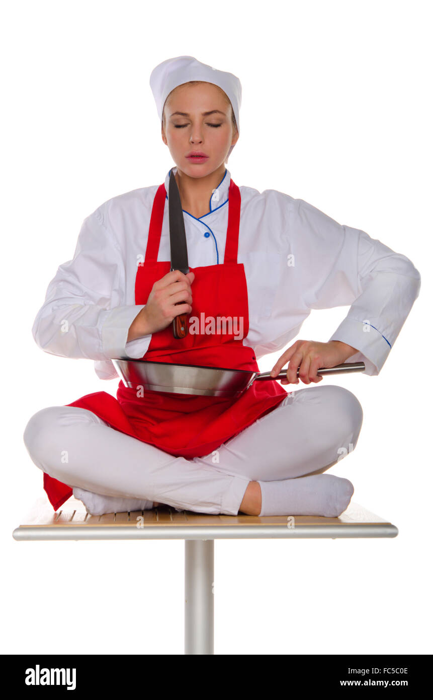 Le méditant cuisiner avec des plats Banque D'Images