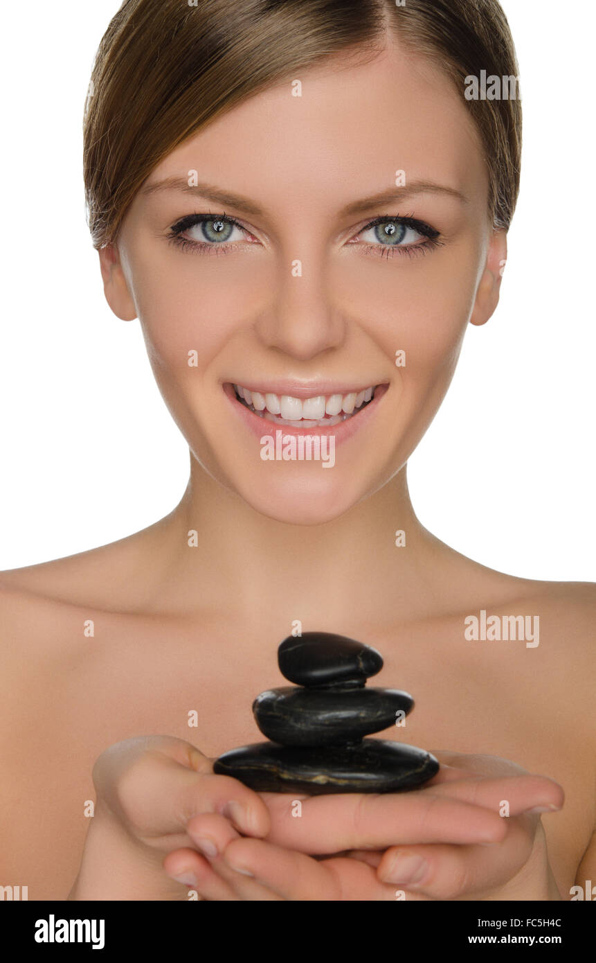 Smiling woman holding stones dans la main Banque D'Images