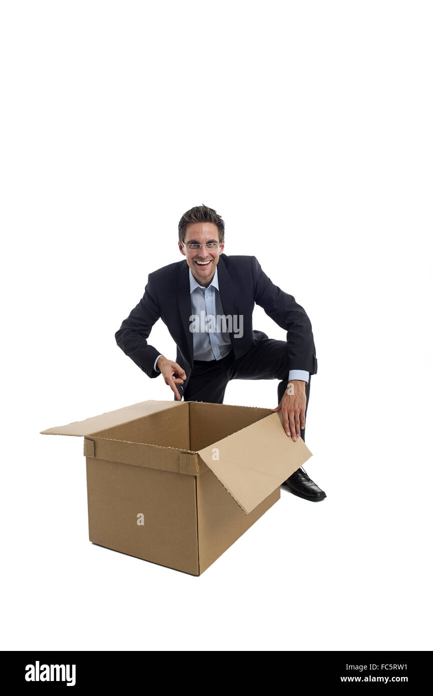 Businessman with a box Banque D'Images