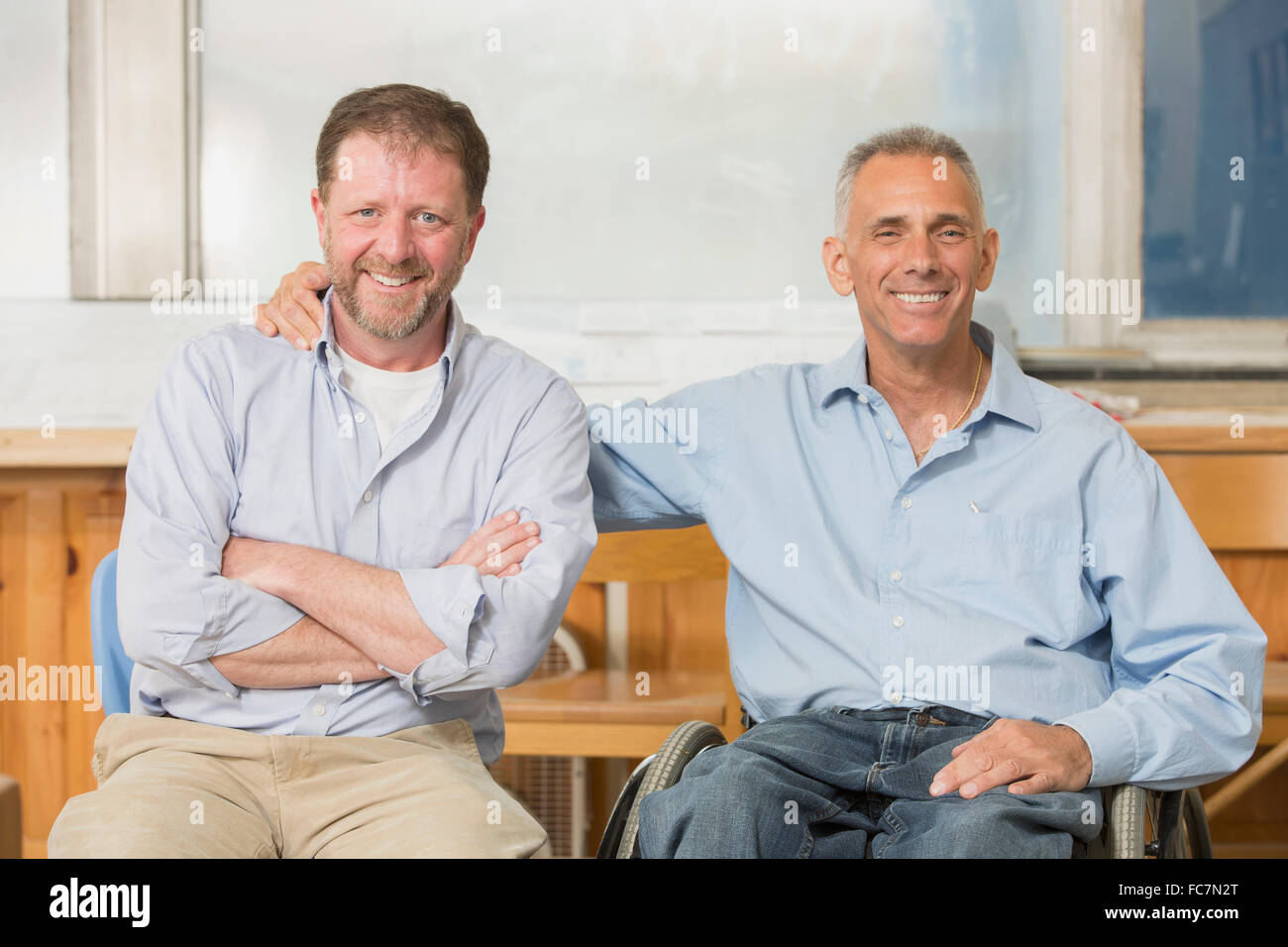 Portrait businessmen smiling in office Banque D'Images