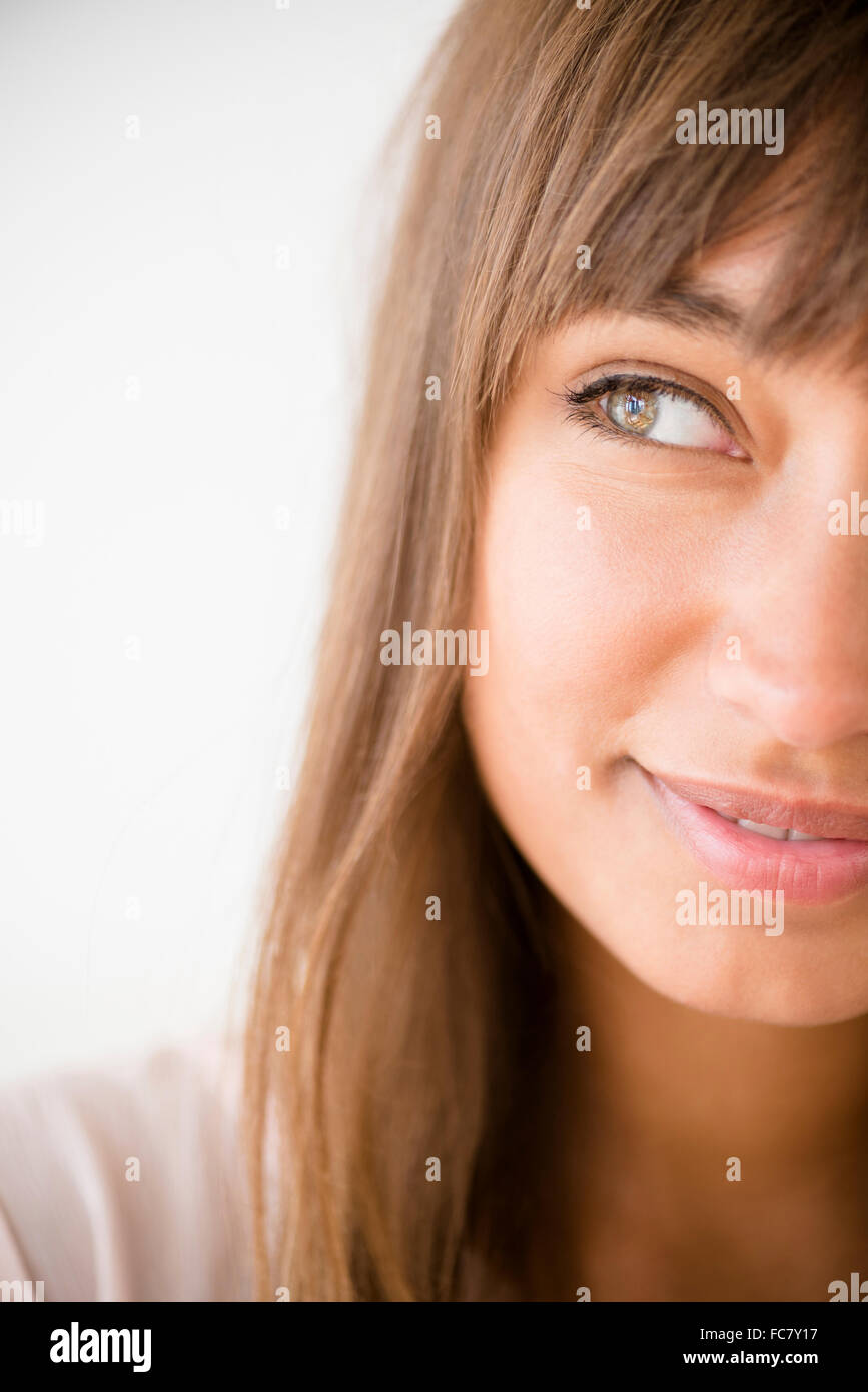 Mixed Race woman looking away Banque D'Images