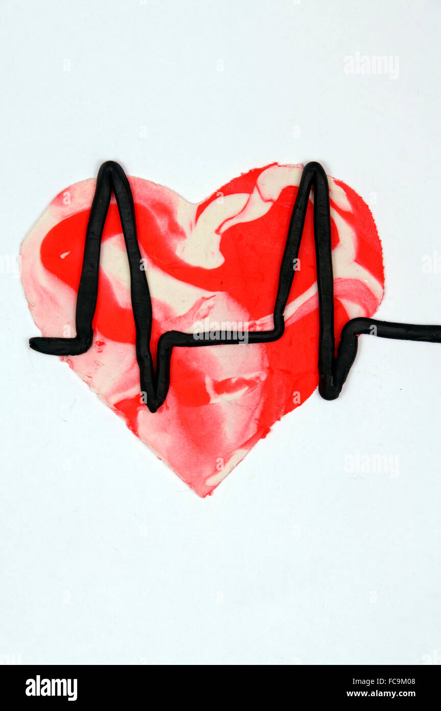 Coeur et symbole de moniteur fait de Play Doh. Banque D'Images