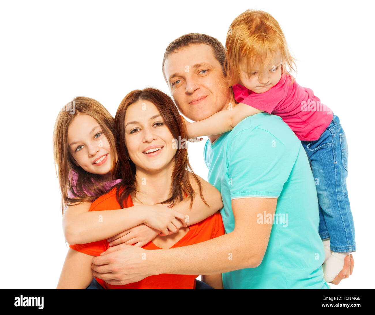 Happy smiling hugging famille de quatre Banque D'Images