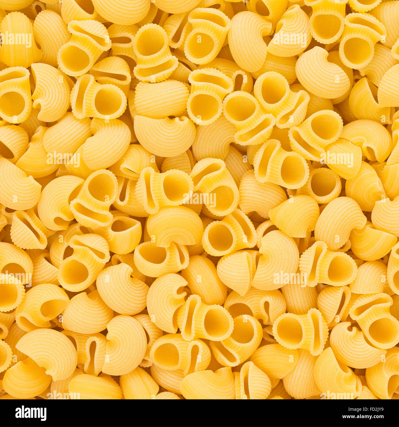 Tuyau Rigate pâtes italienne Macaroni cru de nourriture ou de fond texture close up Banque D'Images