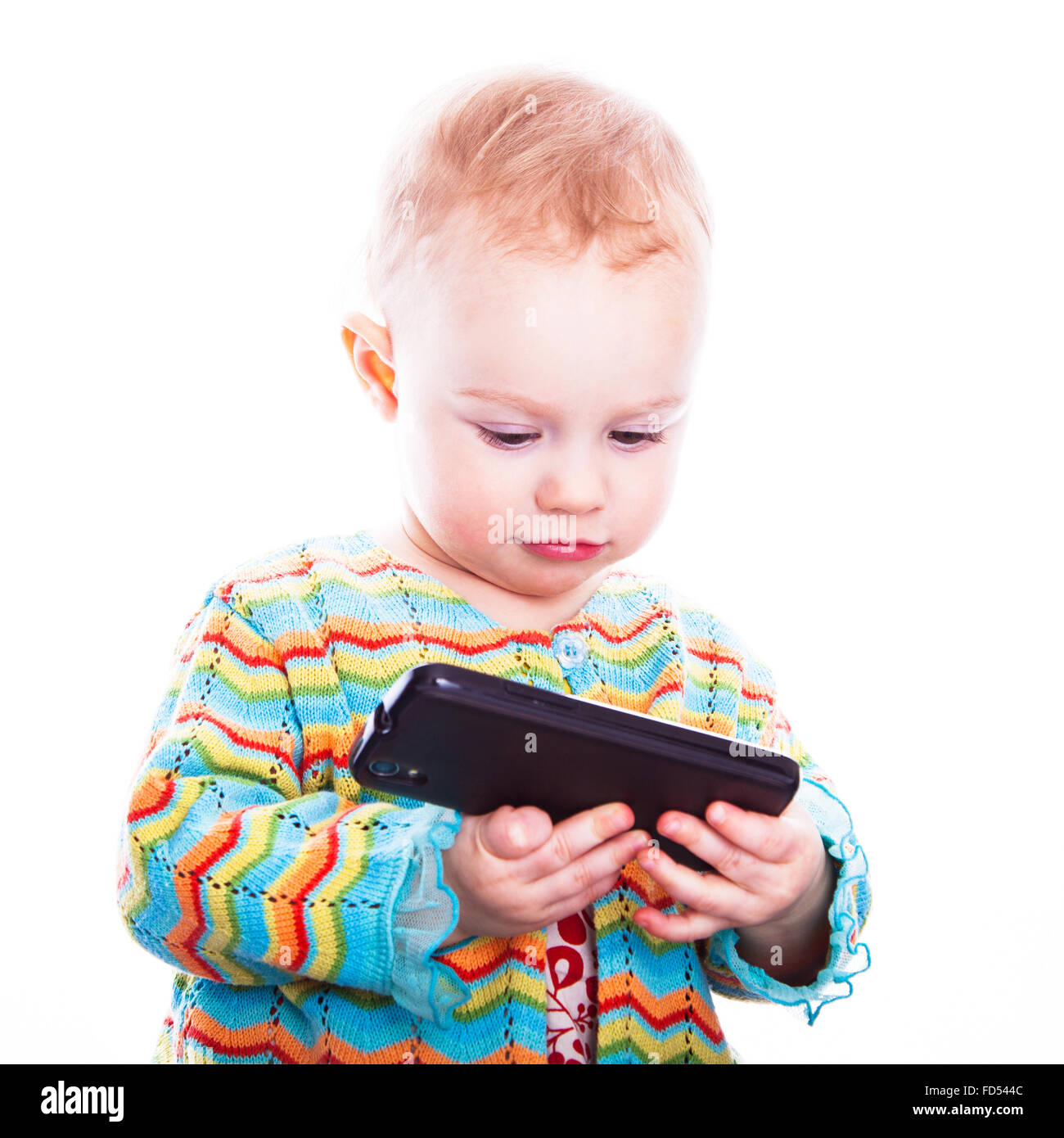 Cute baby girl with mobile phone Banque D'Images