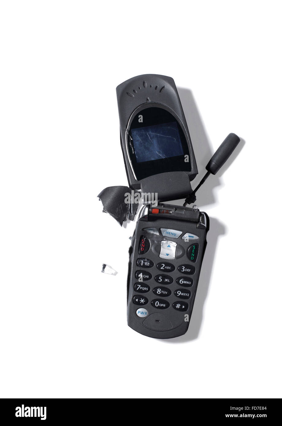 Studio shot of a broken et dépassées téléphone mobile Banque D'Images