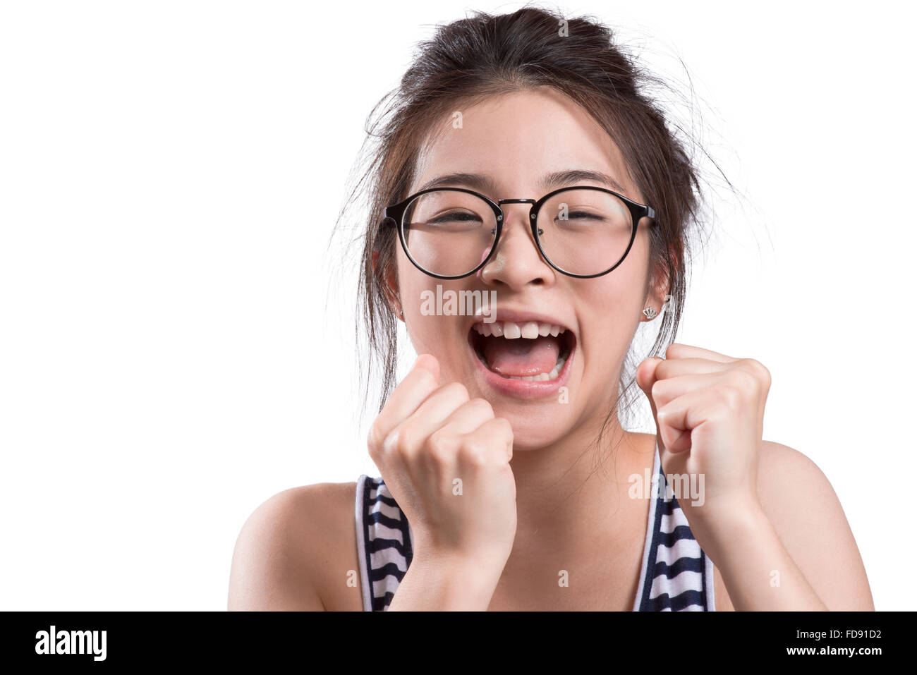 Portrait of young woman cheering Banque D'Images