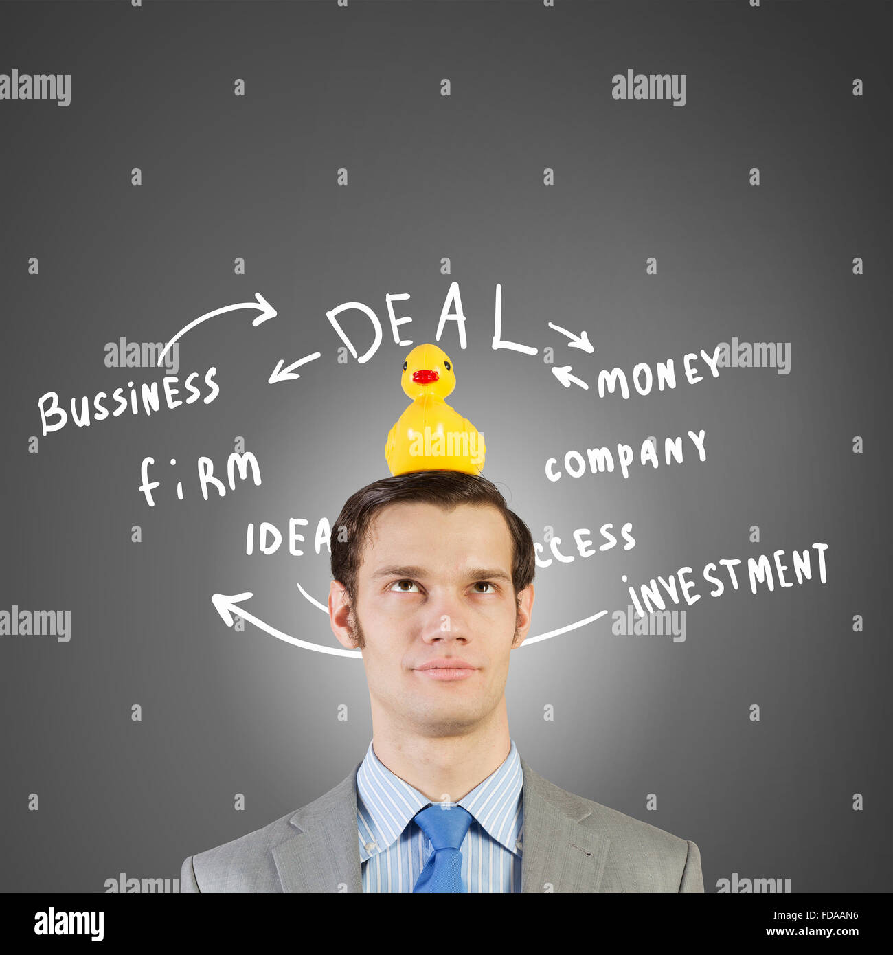 Funny businessman with yellow rubber duck toy Banque D'Images