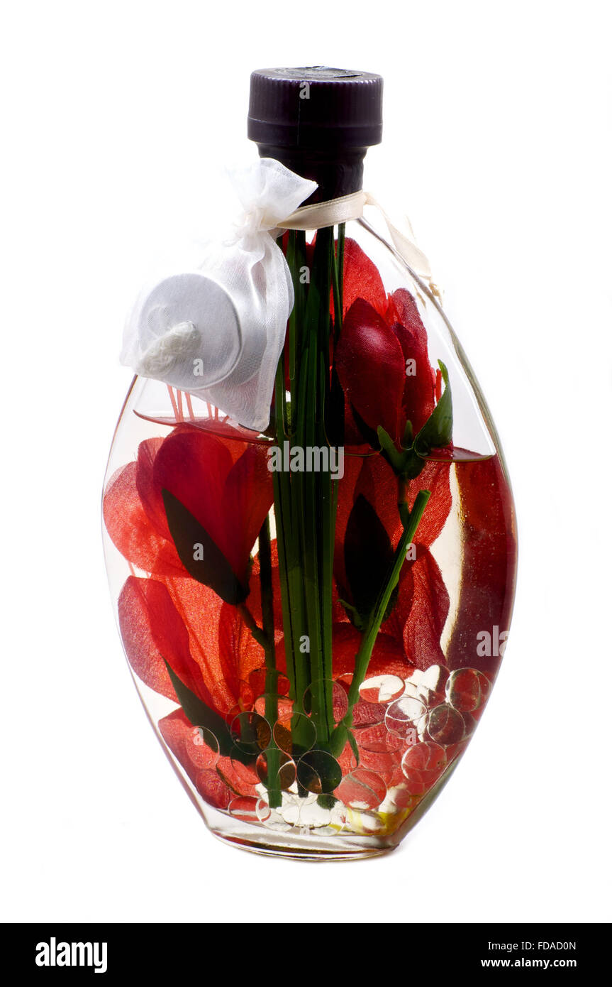 Bougie d'huile aromatique avec fleur rouge à l'intérieur Banque D'Images