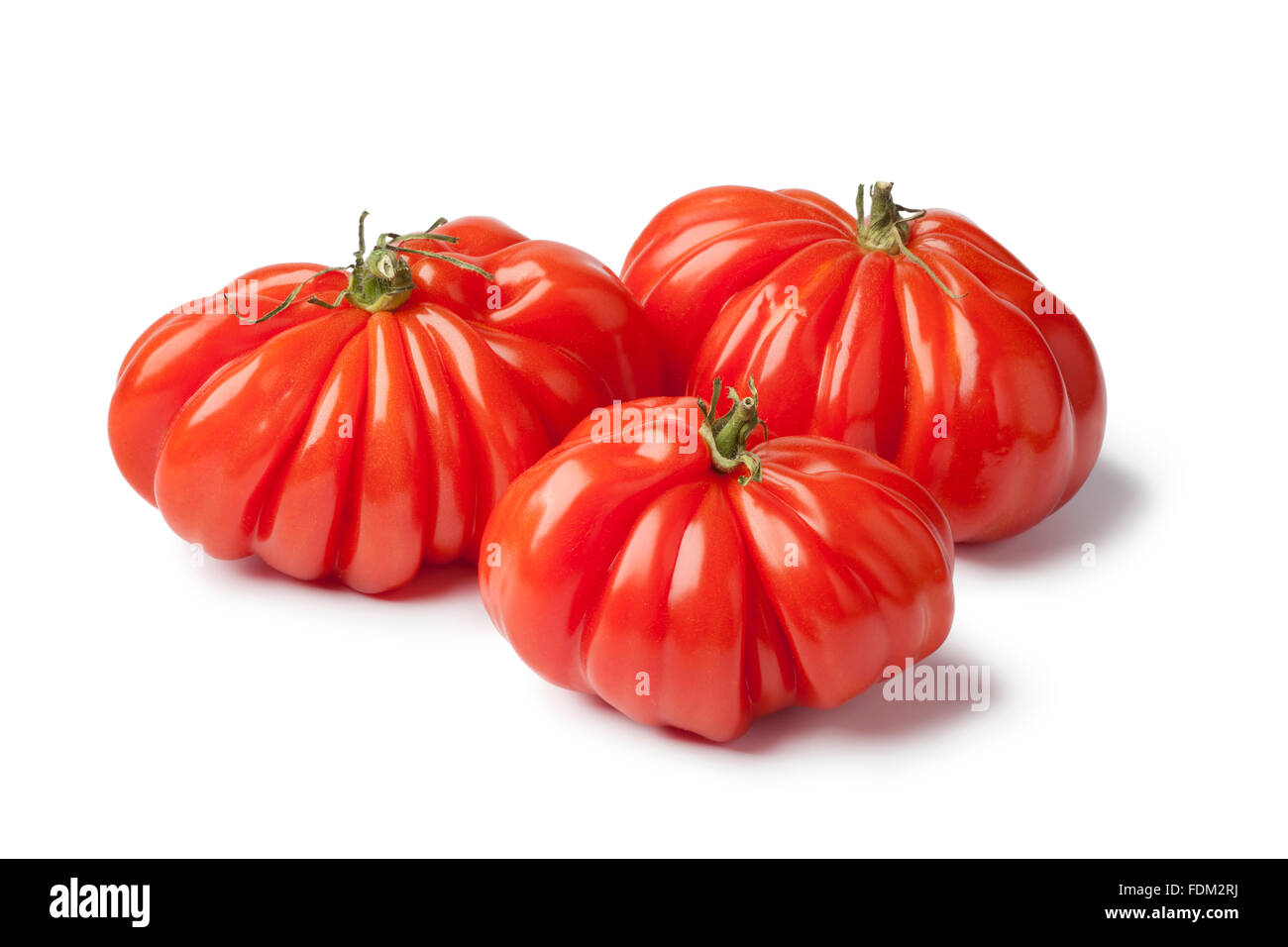 Produits frais bio tomates rébellion sur fond blanc Banque D'Images