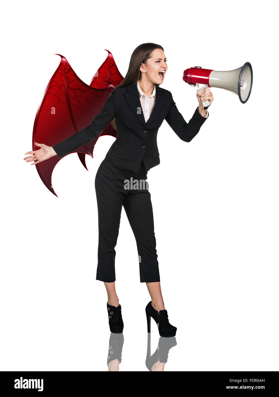 Devil woman screams à megaphone Banque D'Images