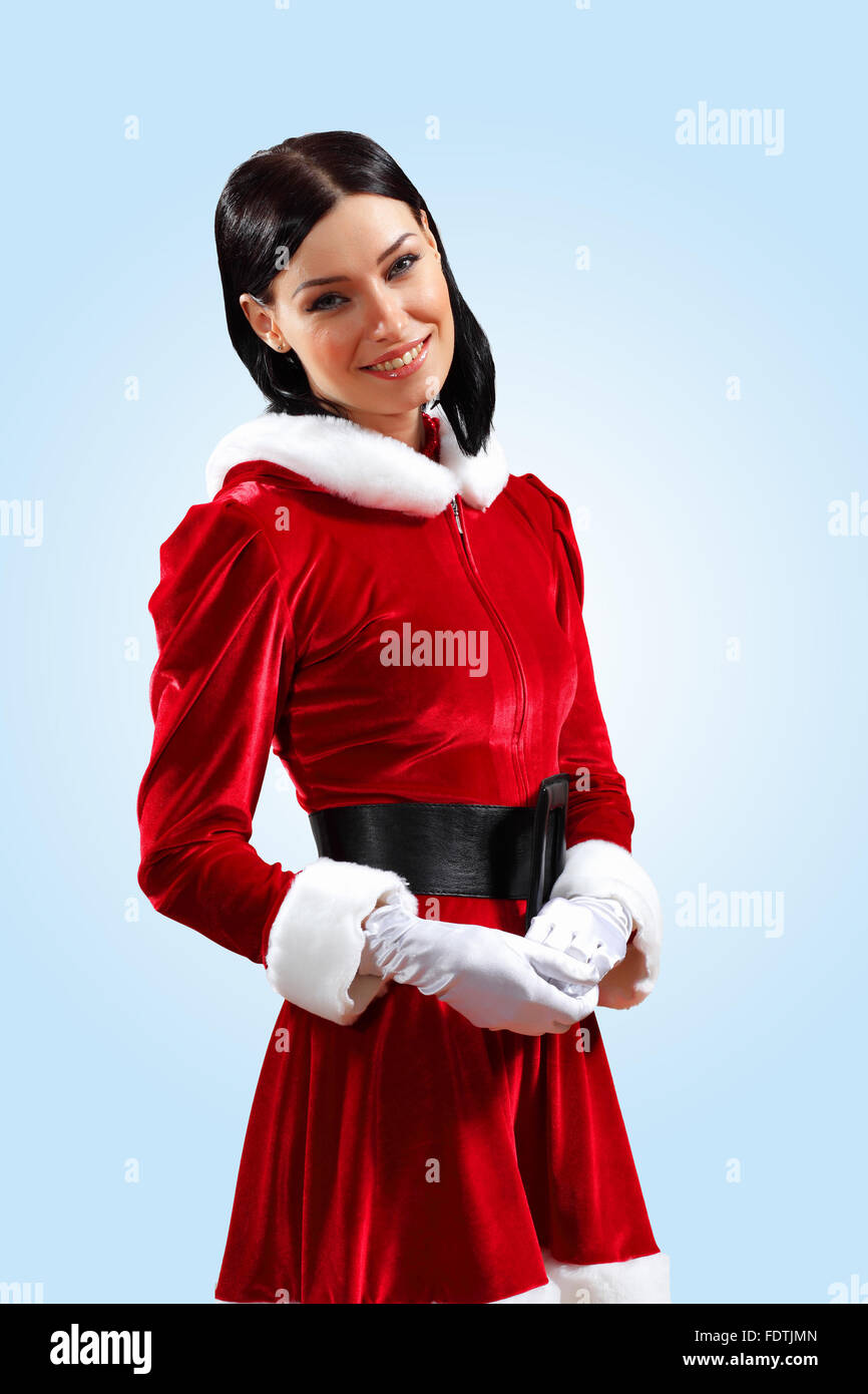 Santa Girl Présentation de votre produit, en costume et gants blancs Photo  Stock - Alamy