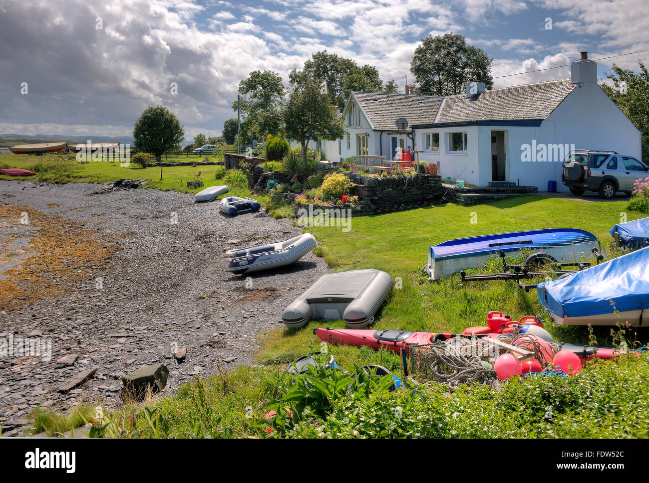 Vue d'été sur l'île de Luing dans le village d'Toberonochy,Luing,Argyll, Ecosse. Banque D'Images