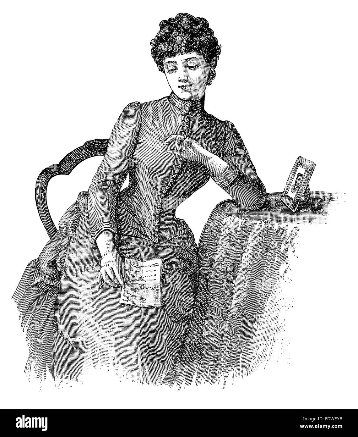 Vintage gravure d'une dame victorienne assis à une table la lecture d'une lettre d'amour. Banque D'Images