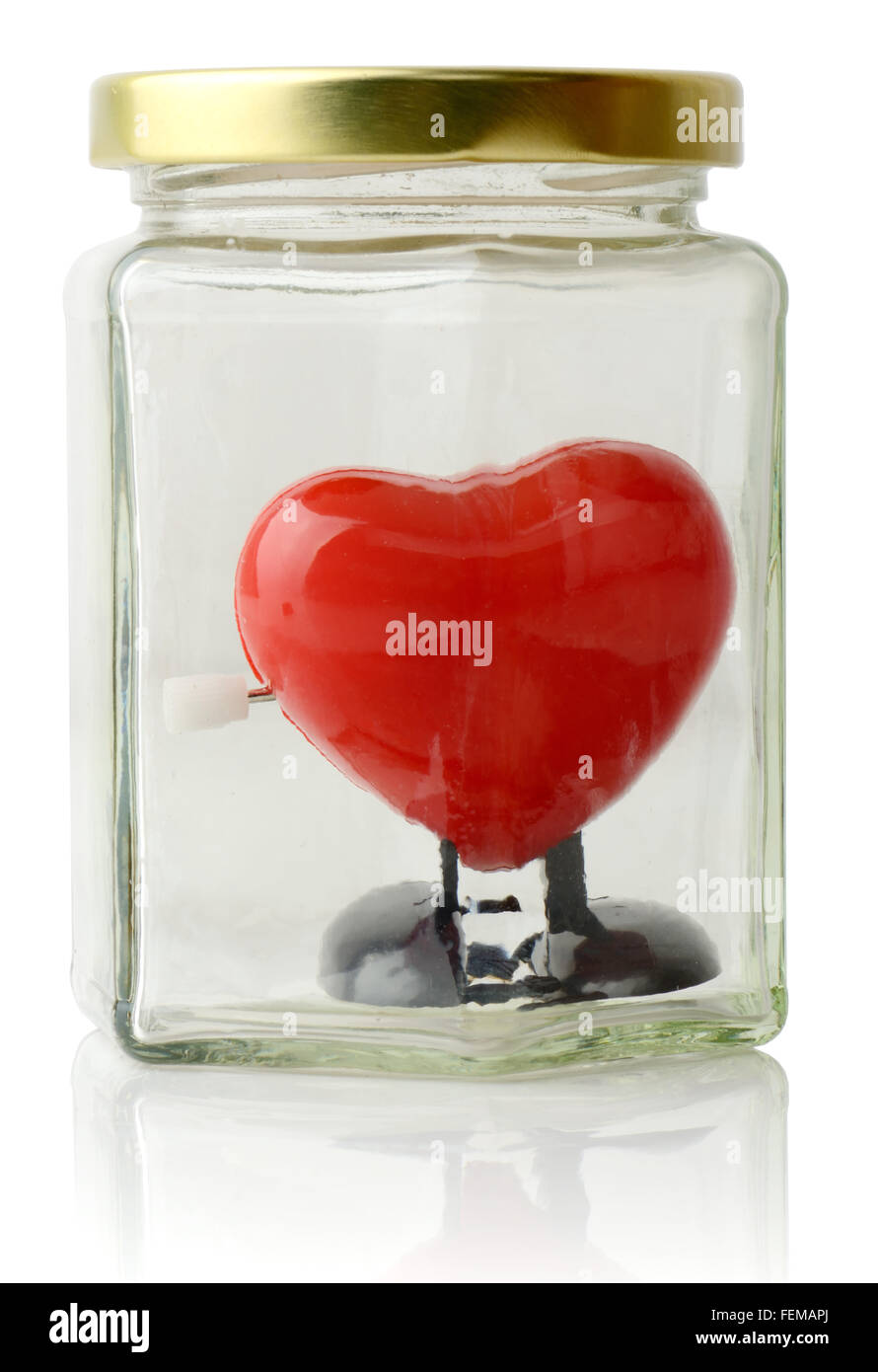 Coeur rouge protégé dans un pot blanc sur isoalted Banque D'Images