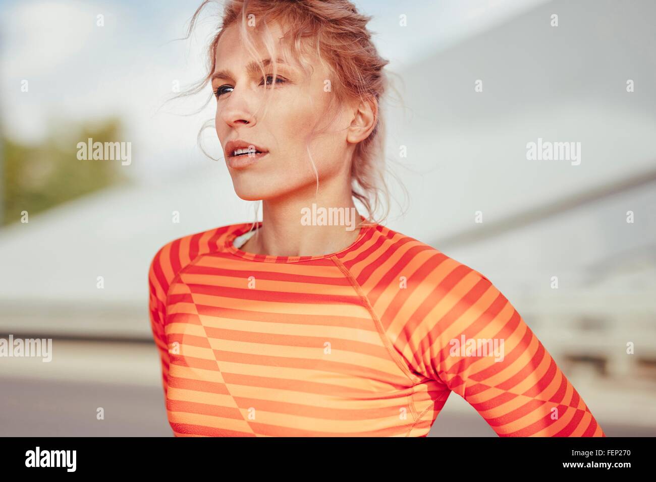 Portrait of young female runner Taking a break Banque D'Images