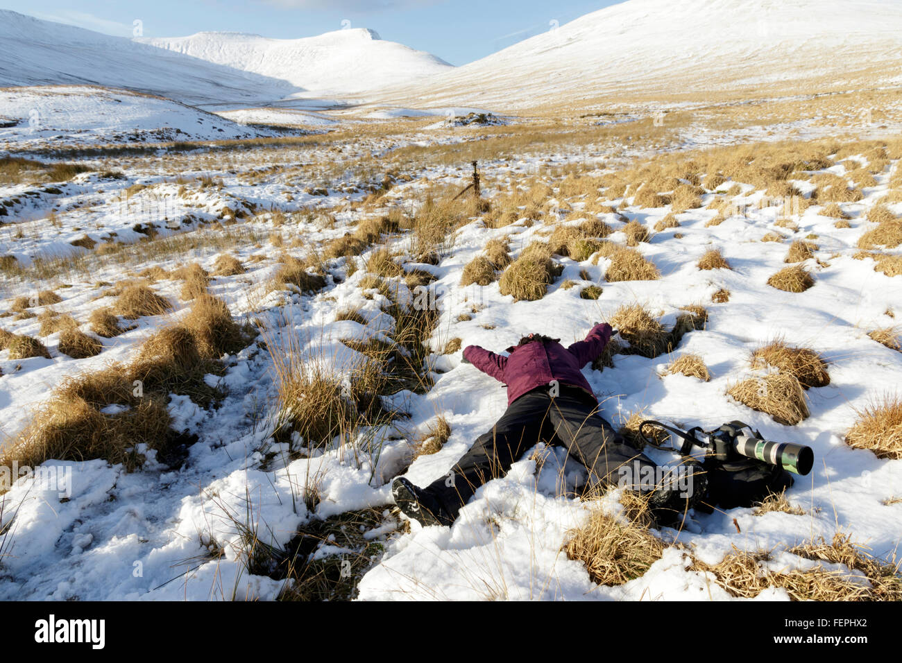 Photographe jouer dans la neige. Banque D'Images