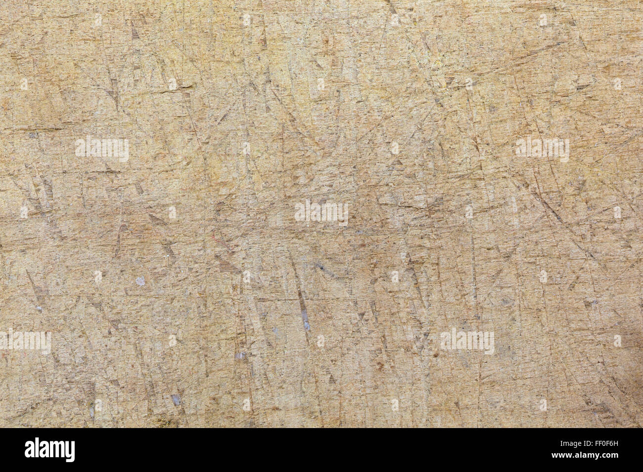 Une vue très proche d'une planche à découper, une multitude de rayures. Banque D'Images