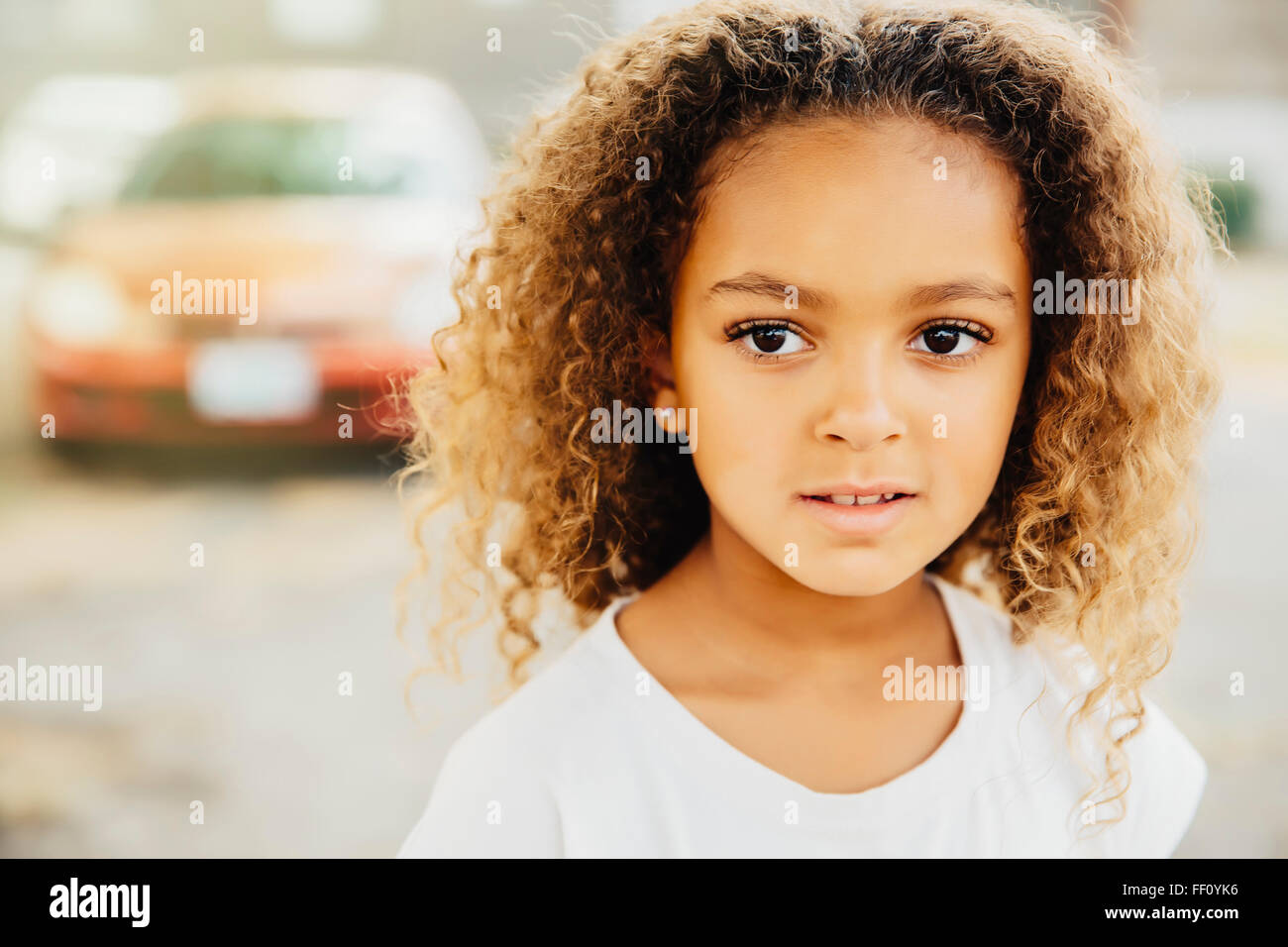 Mixed Race girl with serious expression Banque D'Images